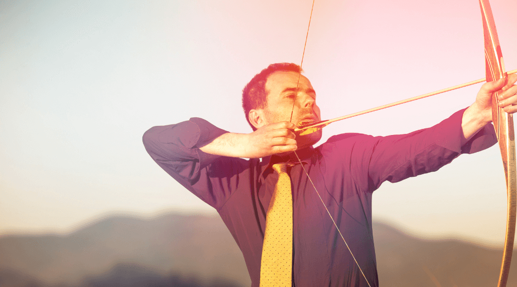 A man shooting with a longbow.